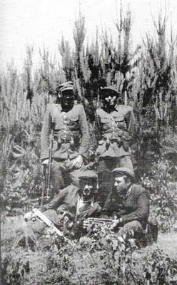 Soldiers from the Adam Kusz “Garbaty” unit in summer 1949. Standing from left are: Wiktor Pudelko “Duzy”, Michal Krupa “Wierzba”. Sitting are: Tadeusz Haliniak “Opium”, and Adam Kusz “Garbaty”.