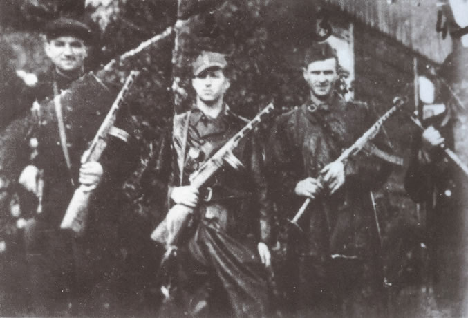 NZW Patrol Unit, c. 1945. Standing from left are: Stanilaw Barski, nom de guerre "Orlik", Zdzislaw KIsielewski, nom de guerre "Olcha", Lt. Franciszek Majewski, nom de guerre "Slony", and Jozef Boguszewski, nom de guerre "Lew"